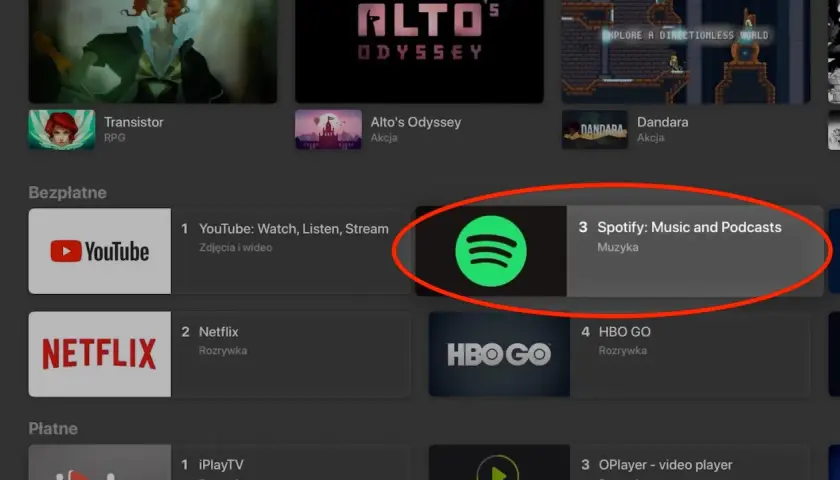 Ikona Spotify na liście aplikacji telewizyjnych, obok YouTube i Netflix.
